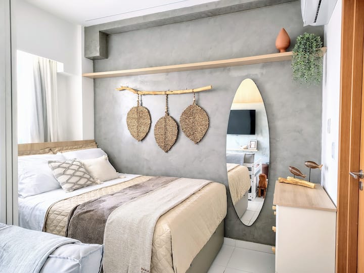 Boho Contemporary Room with double bed, 100% cotton bedding (300 yarns), 4 drawers dresser, mute with cozy light fixture, split air conditioning of 18,000 BTUs (cold) and blackout curtains.