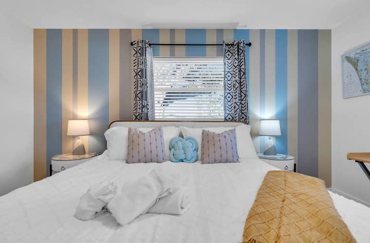 Experience ultimate comfort in our master bedroom with plush bedding that promises a restful night’s sleep.