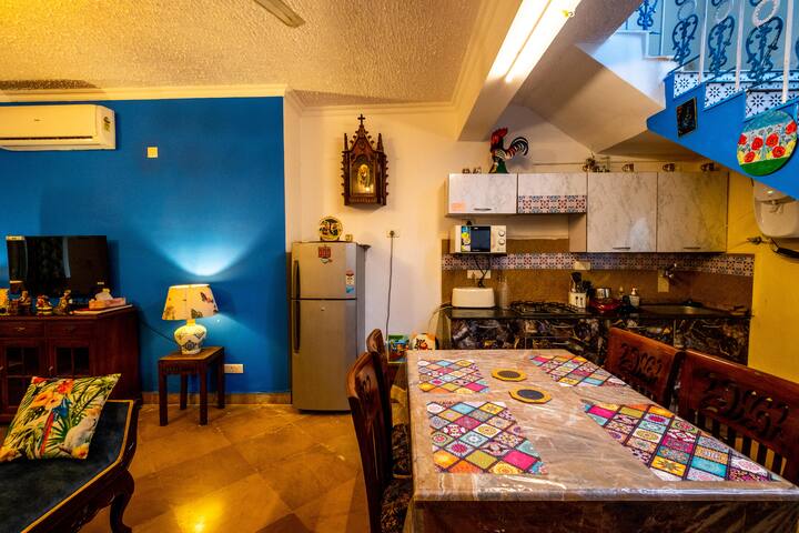 "A simple yet inviting dining area perfect for family dinners or casual conversations over food.