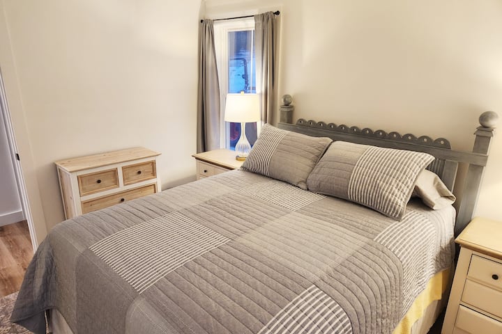 Our queen sized bedroom offers a plush mattress, soft linens, quilts and blankets. In the winter months, we have cotton flannel sheets to keep you warm!  Thoughtfully furnished with bedside tables, and ample lighting, the room is functional and cozy!