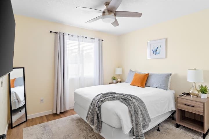 Relax in a cozy, light-filled bedroom offering plush bedding and ultimate comfort.