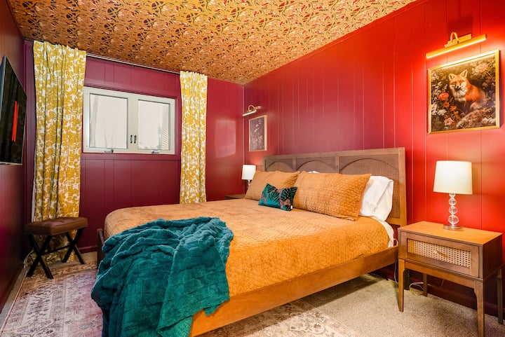 Main level bedroom: King bed, Helix mattress, HDTV and kid's items (high chair, pack n play, changing pad) in the closet