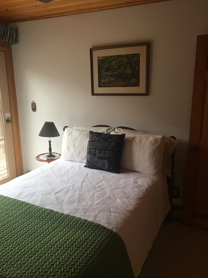 Roadside second bedroom; double bed with private roadside balcony shared with sitting room on the same side.