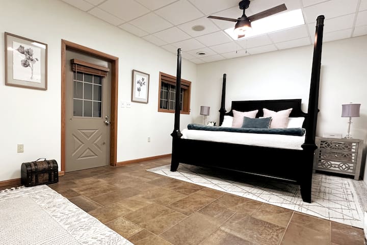 "This serene bedroom is  featuring a comfortable bed that promises a restful night’s sleep. With soft linens, soothing colors, and walk in closet