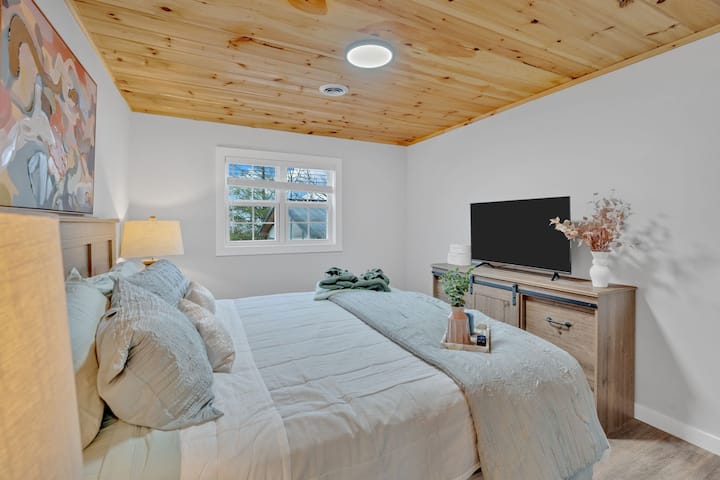 Bedroom Retreat: Serene space with plush bedding, natural light, and stylish decor awaits!