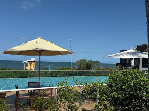 Popular Airbnb listing: Foot in the sand with infinity edge in home club top! in Balneário Piçarras