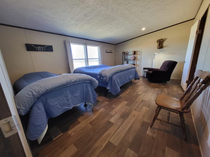 Master bedroom has one king bed and one twin bed.  All mattresses and pillows are memory foam.  A reading nook with reading light and recliner for your relaxation.