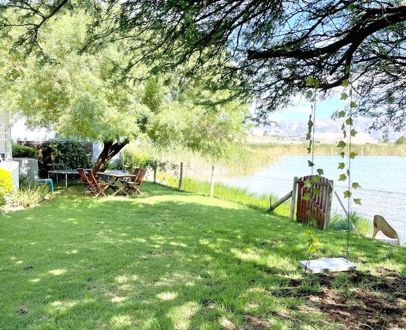 Home in a beautiful setting on the water’s edge gallery image 5