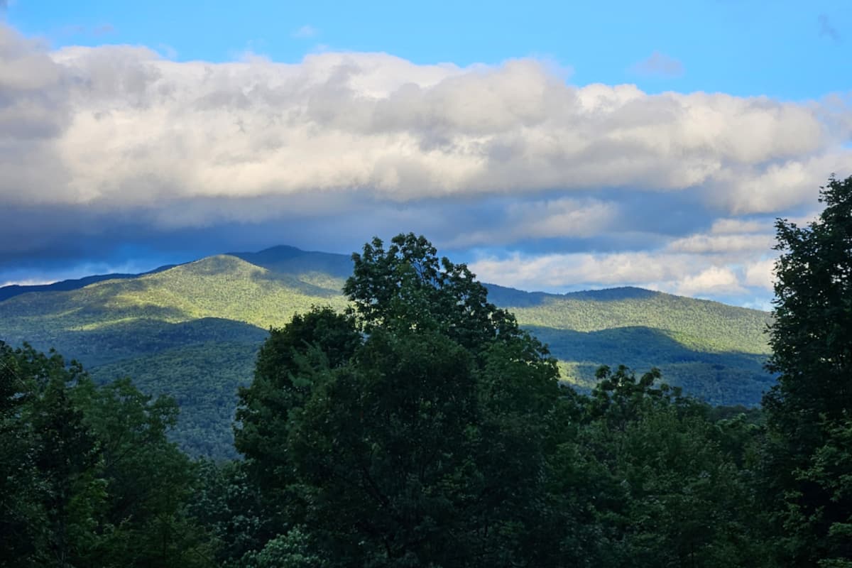 Step outside and find the Adirondacks in every direction — layers of ridgeline that go on longer than you'll be here.