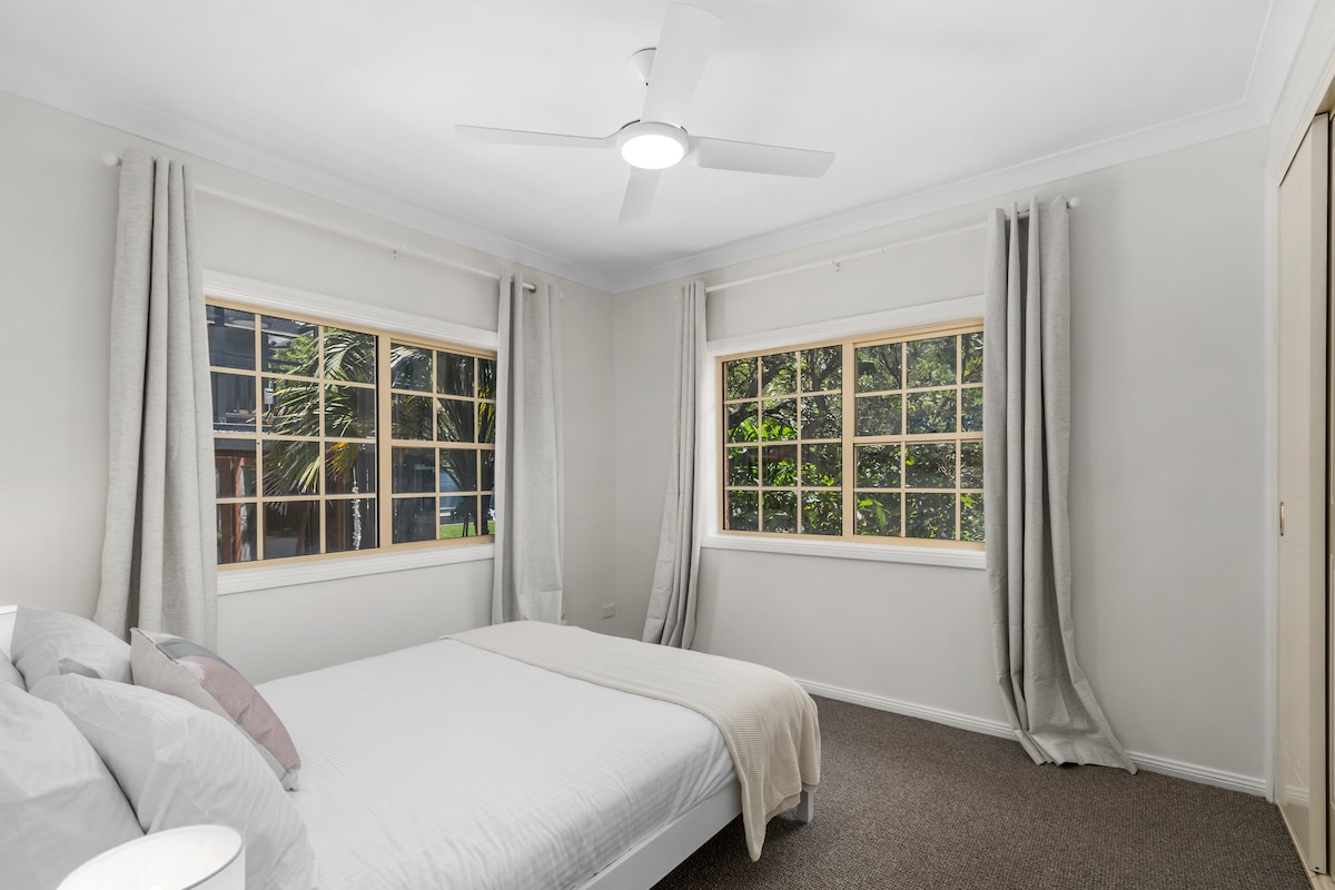 The fourth bedroom includes a double bed and built-in robes.
