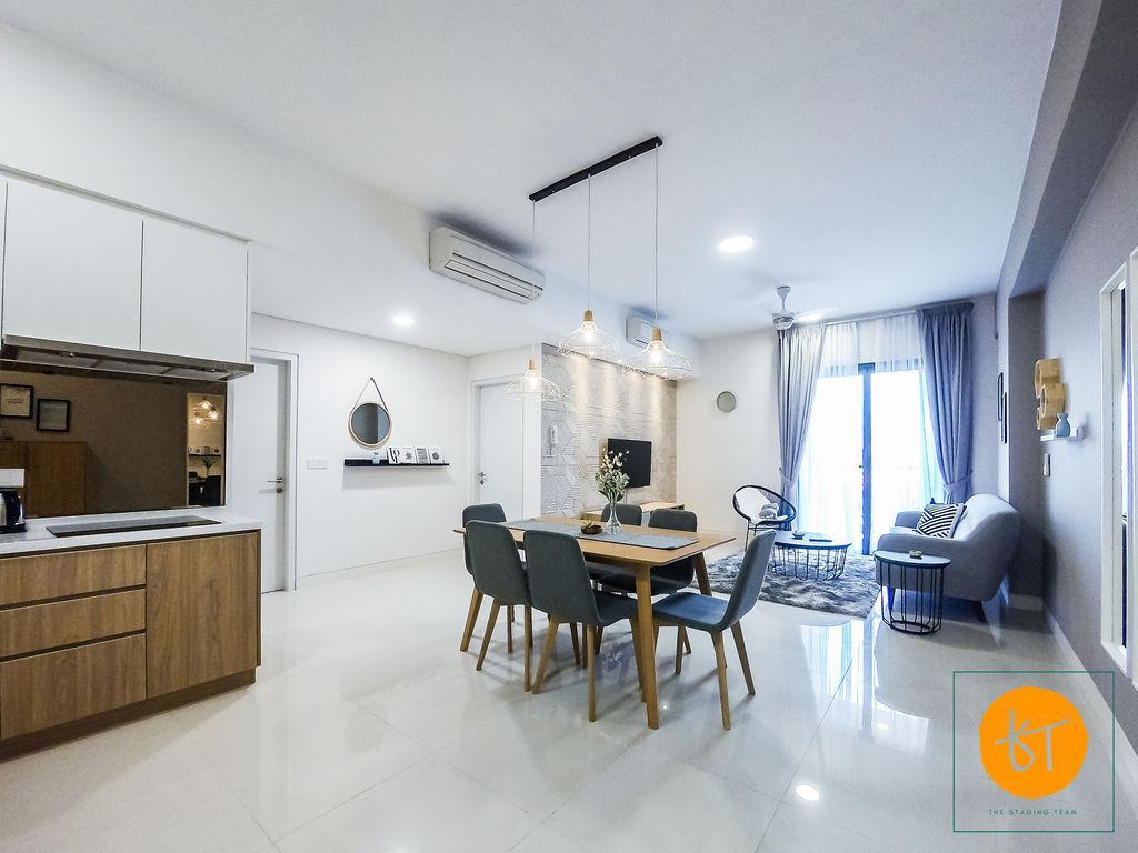 A spacious living and dining area is featured, with modern furnishings that include a dining table with chairs and a comfortable sofa. Natural light flows through large windows, illuminating the neutral decor and highlighting the sleek design elements present in the space.