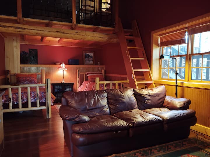 Antler Annex: Located on the lower level of the property you have suites A and B conjoined with a full bath. Suite A has a living room space with two twins and up the ladder is the queen. The queen can also be accessed by an upper-level door. 