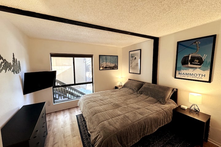 On the first floor you will find the primary bedroom with a spacious king bed.  All furniture and bedding was recently updated. This cozy retreat includes black out shades to help you rest for another day on the mountain.