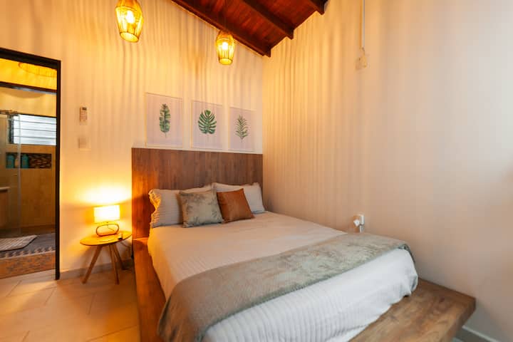 Upon leaving this room, the bathroom is at the back. The room has air conditioning and a 32-inch TV.