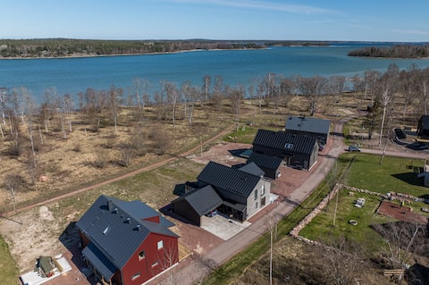 Residential building with sea view, terrace, sauna & boat dock