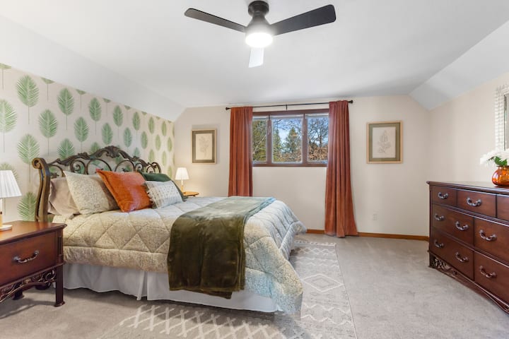 Spacious upstairs bedroom with Queen bed and futon.