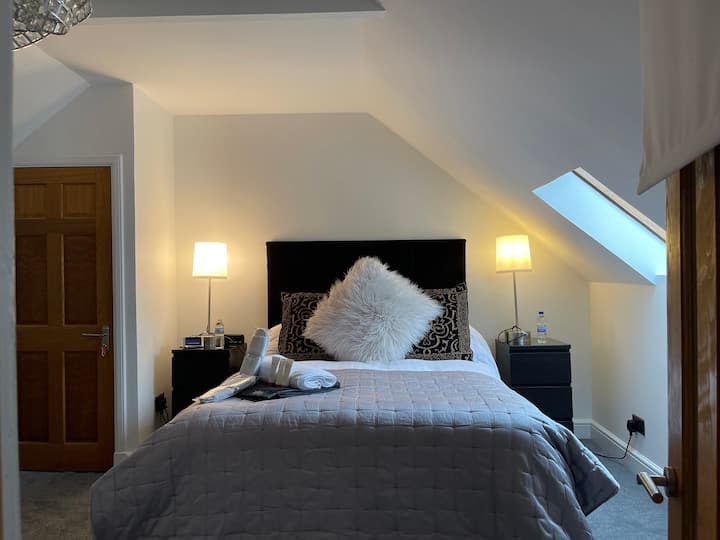 King bed upstairs with Quality bedding & mattresses