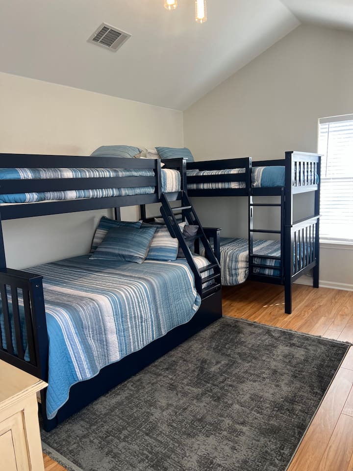Bunk room has twin bunk beds and also additional bunk bed that has a twin top, full bottom and a pull out single.   Direct access to Jack and Jill Bathroom.