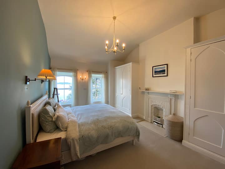 The master bedroom on the top floor has stunning views over Cork harbour. The super king bed is very comfortable and this serene bedroom will provide you with a quiet calm space for sleeping. Plenty of storage to unpack and feel at home.