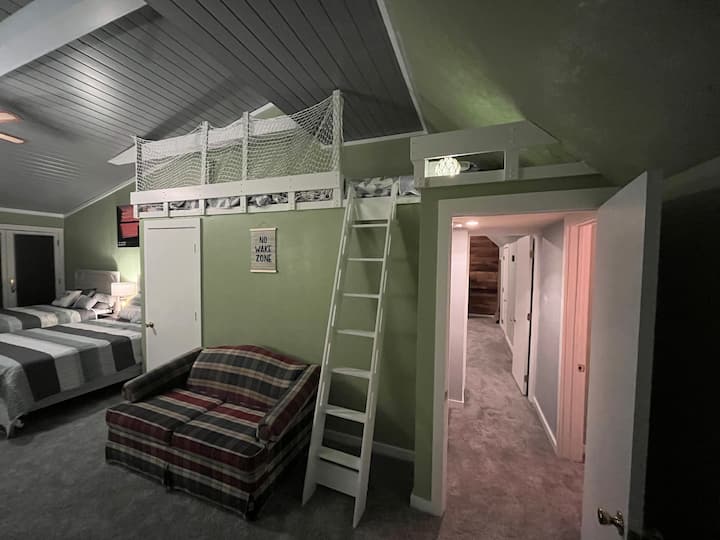 Guest bedroom on 2nd floor with view of the two bunk beds (and hallway leading to spare bedroom with twin on immediate right, and master bedroom at end of hallway).