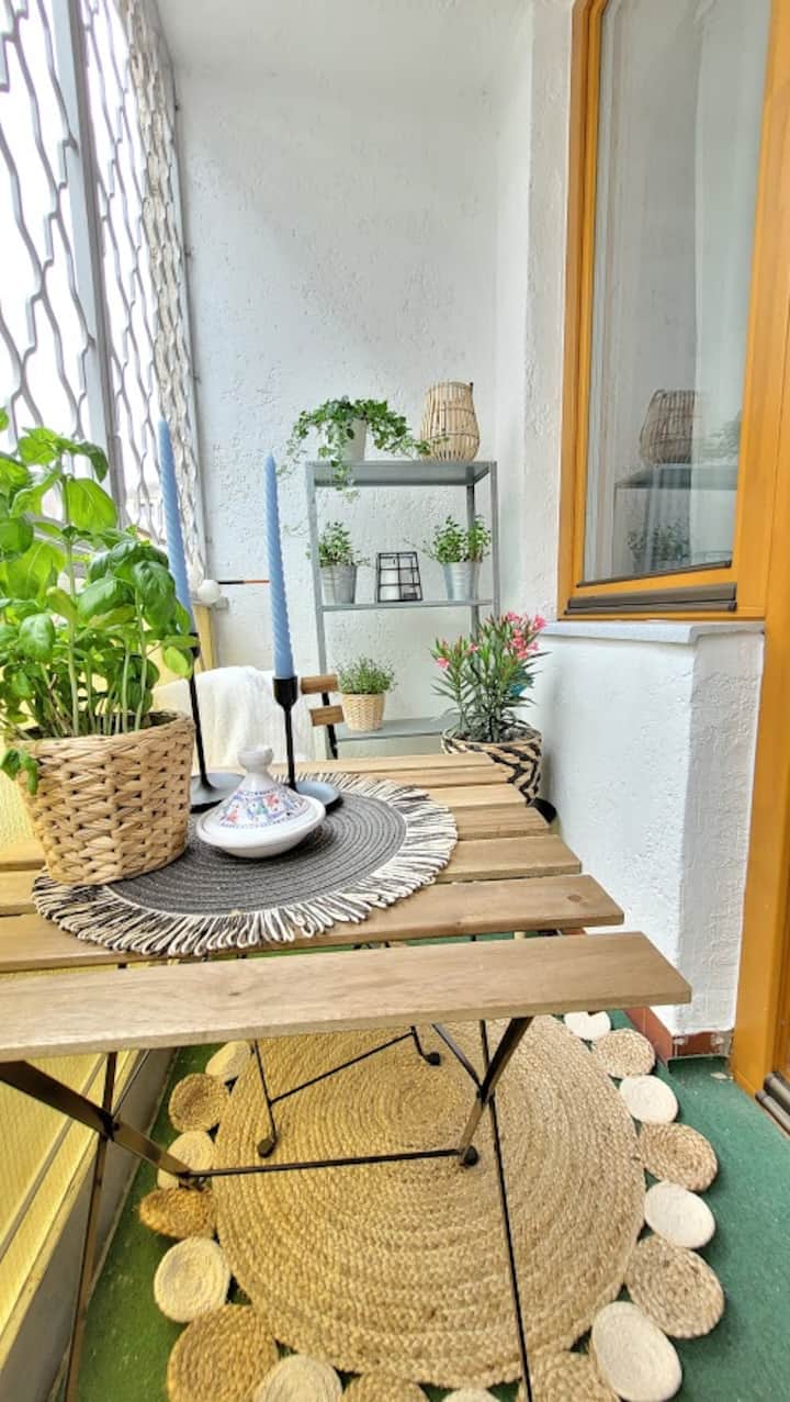 Workspace evidence from Cozy, modern studio with balcony