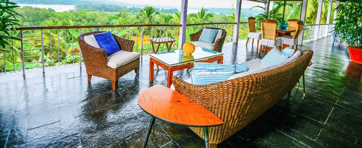 Spacious balcony with ample seating in our 5BHK Luxury Villa in Goa. Enjoy lush green views and a relaxing outdoor retreat.
