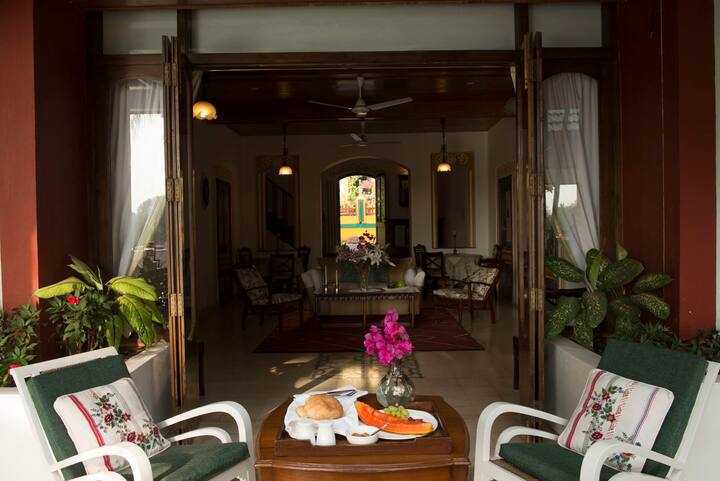 Enjoy breakfast with a view on our charming balcony, overlooking the villa's elegant living space. This serene outdoor area is perfect for starting your day in peace at our 6BHK Luxury Villa in Goa.