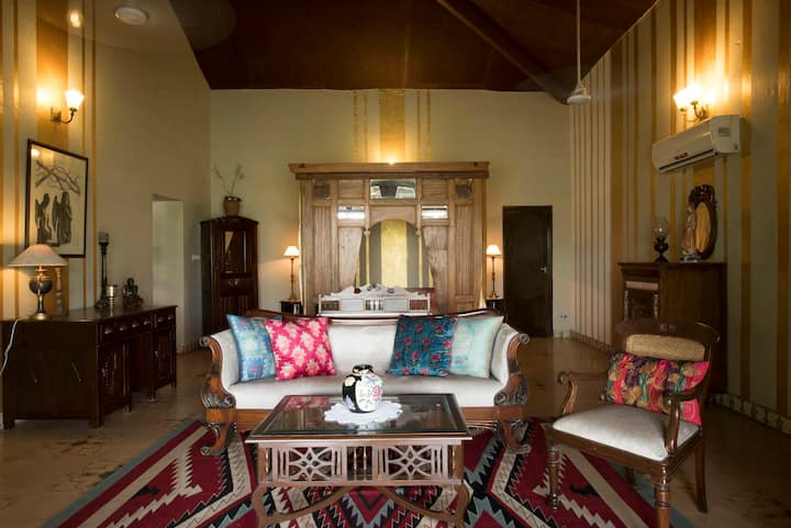 Relax in our spacious living area, a perfect blend of classic elegance and modern comfort. The unique decor and plush seating invite you to unwind and make memories at our 6BHK Luxury Villa in Goa.