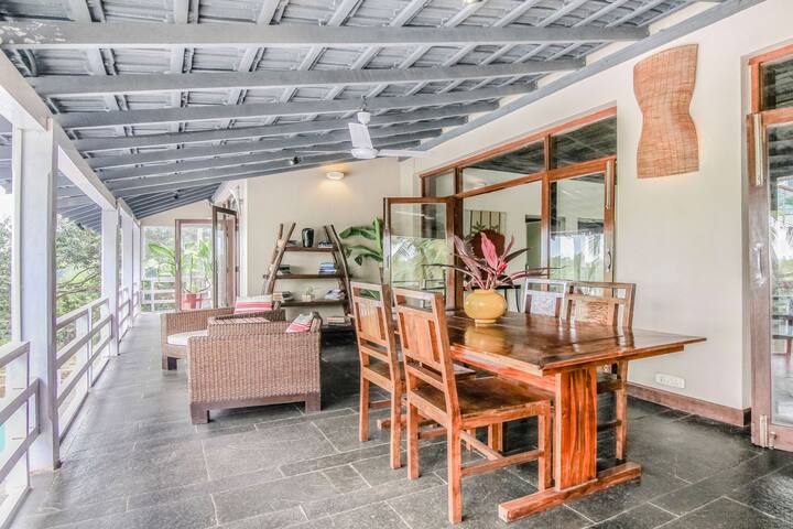 Indulge in alfresco dining & relaxation on the expansive veranda of this Luxury Villa in Goa. Perfect for enjoying the breezy ambiance with your group in this 7BHK retreat.