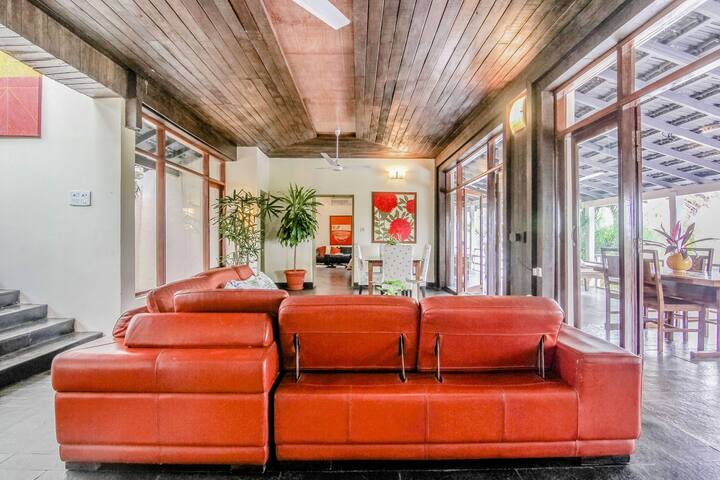 Experience luxury at this 7BHK villa in Goa! Enjoy spacious living with comfy seating, vibrant art, and a serene ambiance for your perfect getaway.