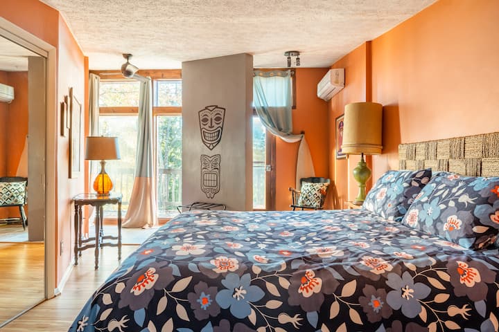 Another shot of one of the two upstairs bedrooms.  The bedrooms are adjacent to a full bath and the loft.

Feel free to stand out on your own personal balcony and yell "Show Me Your Tikis!" to the neighborhood (we've already warned them about you).
