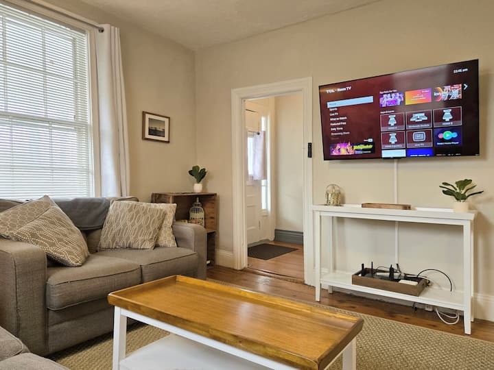 Spacious living room features an oversized smart TV so you can have a night-in and watch a movie or binge your favorite shows.