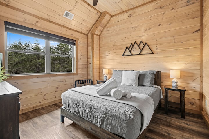 Queen bed room equipped with smart tv