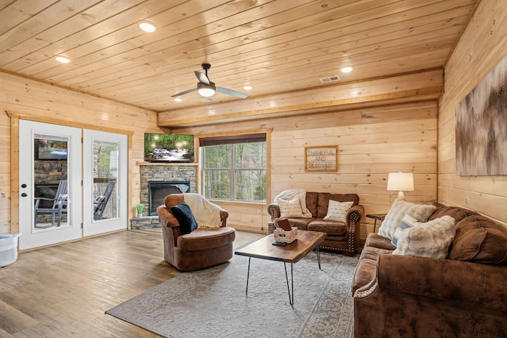 Living room seating for the entire family, with 50" Roku TV and electric fireplace.