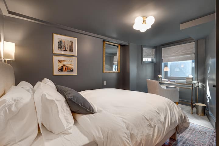 Unwind in Bedroom 1, featuring a cozy queen-size bed and a relaxing atmosphere.