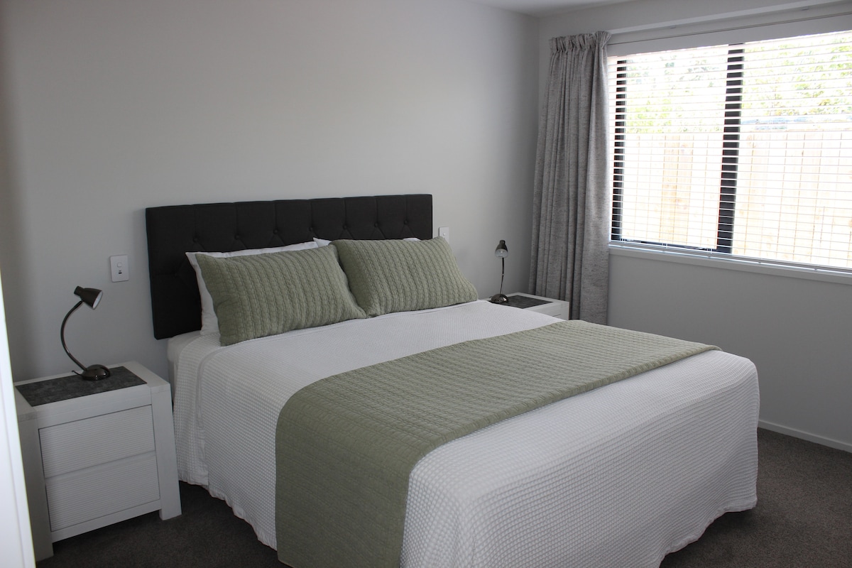 All the bedrooms are equipped with ultra-comfortable mattresses and pillows and phone charging points.
This master bedroom has an ensuite with shower and walk-in wardrobe.