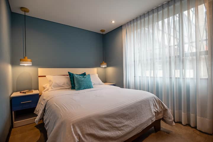 Comfortable double bed with a large window that lets in light, and has a blackout curtain. @hostygroup