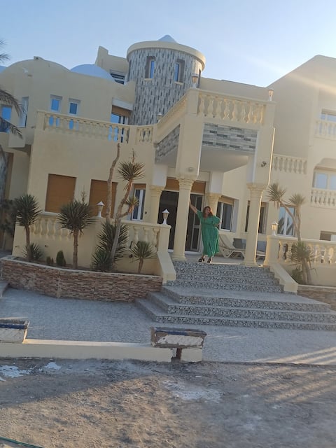 beach-front castle with large swimming pool