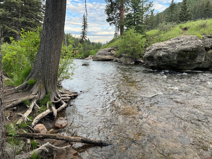 The cold, clear Pecos River flowing through the cool canyon in summer