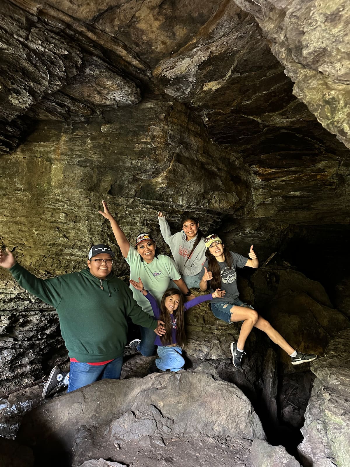 Guests exploring a cool cave near Vida Bonita Pecos