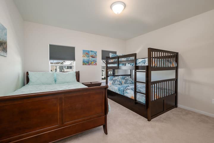 Enjoy one of our two extended family upstairs bedrooms equipped with a unique theme if you want girls in one room and boys in another. This one we have themed more for the guys with queen bed, a full/full sized bunk bed with a twin trundle bed too!