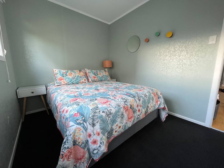 The second room has a double bed with a wardrobe to pack and hang your belongings away.