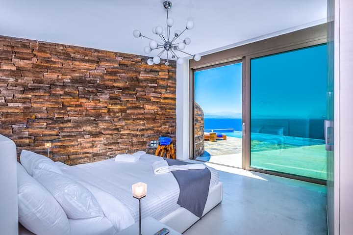 Ground Floor: Bedroom 1 with king-size bed and wellness-style shower