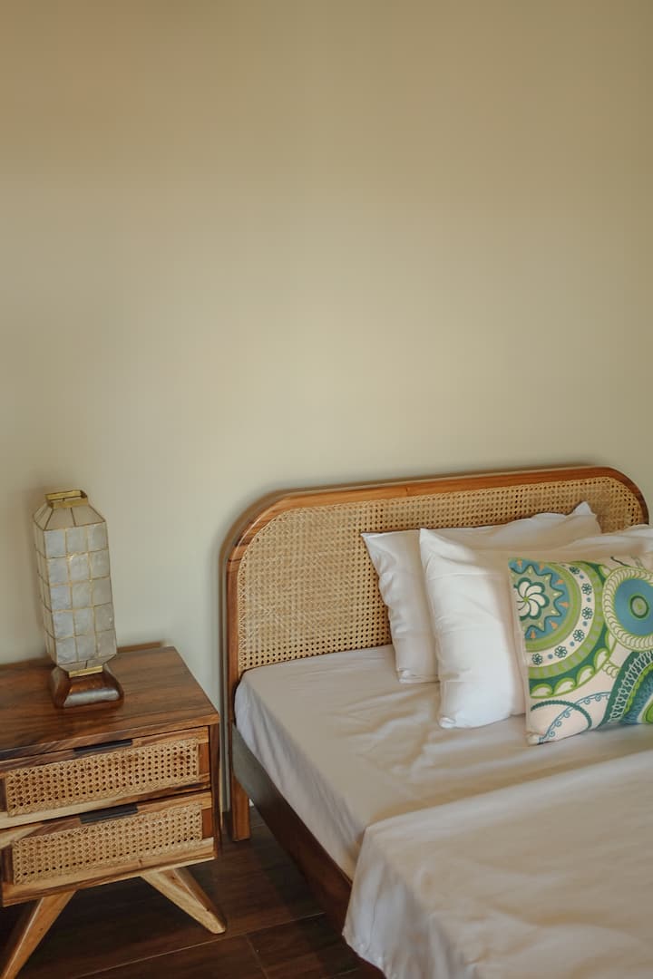 Triple bedroom featuring three double-sized bed with en-suite toilet and bath with heater.