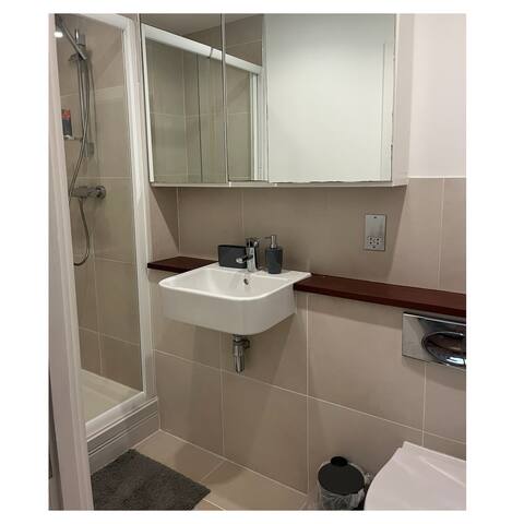 Bathroom with shower and basin