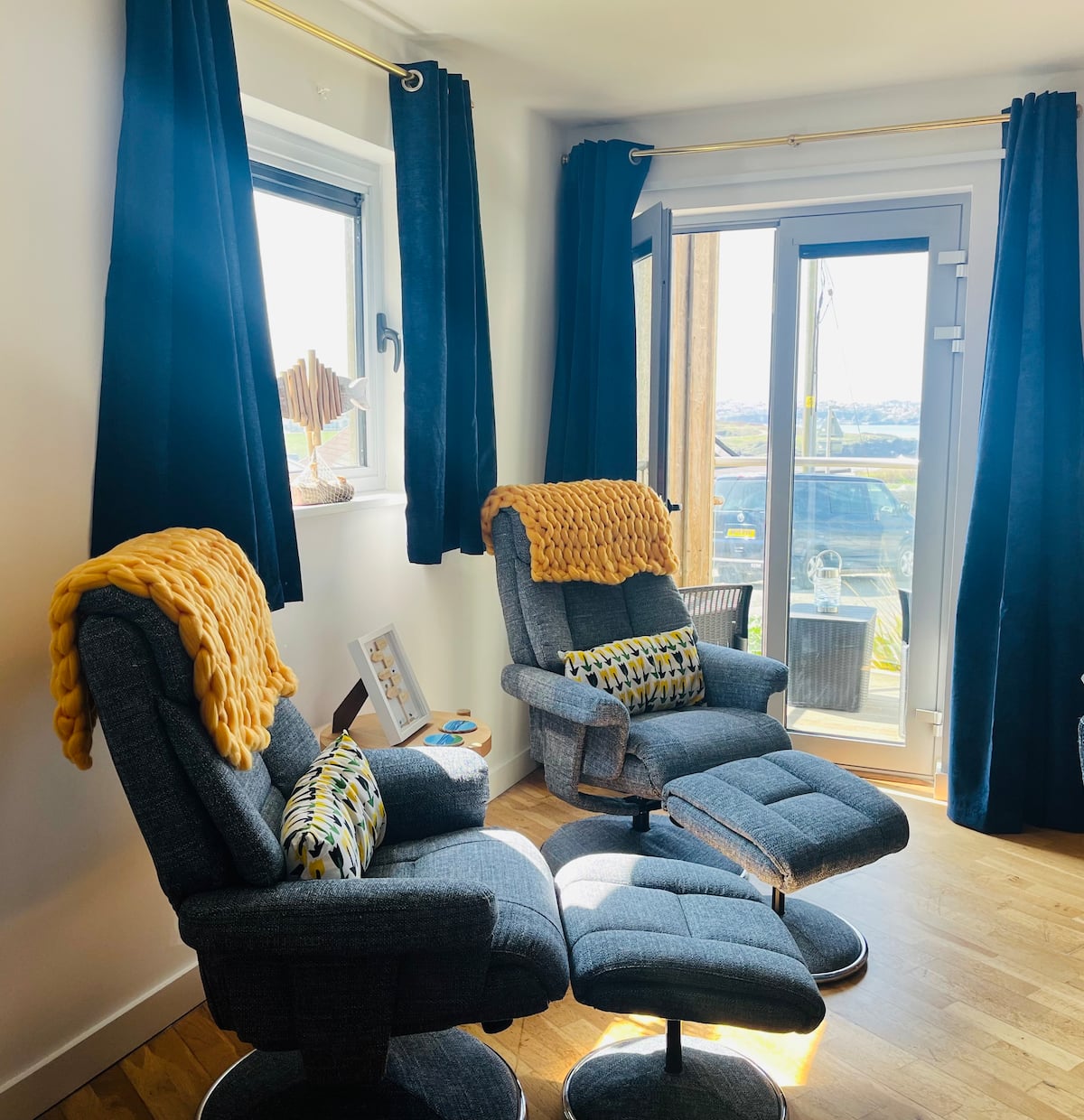 Recliner chairs facing the balcony windows