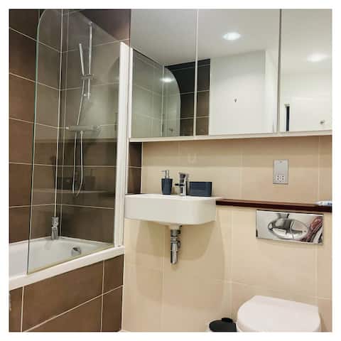 En-suite with bath, shower and basin