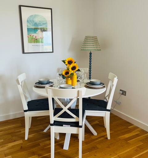 Dining table set for four with sunflowers