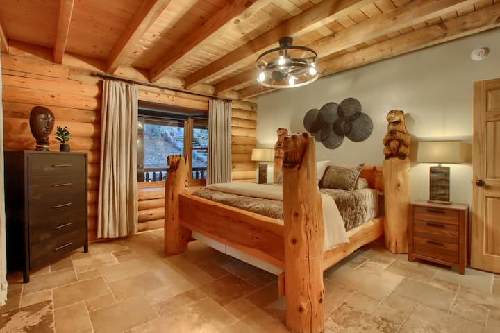 Warm, rustic bedroom with wooden furniture and soft lighting.