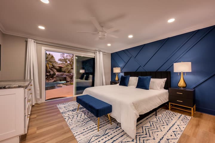 Master bedroom with pool & waterfalls views & sounds, private closet & bathroom: Indulge in your heavenly $9500 Kohler Birthday Bathtub, dual shower, dual sinks, large slider inviting you to step out directly into your personal poolside paradise.